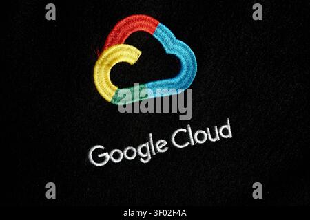 DALLAS, TX, USA - FEBRUARY 16, 2024: An embroidered Google Cloud logo featuring red, yellow, green, and blue colors is displayed on a black fabric sur Stock Photo