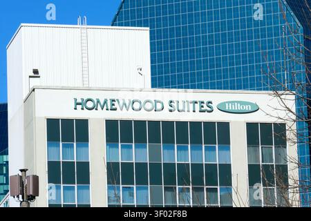 DALLAS, TX, USA - FEBRUARY 16, 2024: The facade of the Homewood Suites by Hilton hotel in Dallas is prominently displayed, featuring the hotel's logo Stock Photo