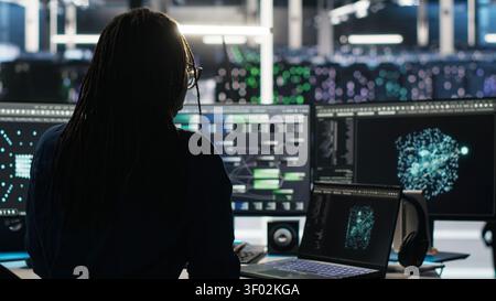 Programmer uses node tree software to identify equipment performance issues and data patterns. Stock Photo
