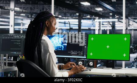 IT colleagues collaborate in a data center while reviewing AI diagnostics and infrastructure performance. Stock Photo