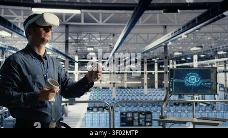 System administrator uses a VR headset in a server room to adjust AI systems and improve processing performance. Stock Photo