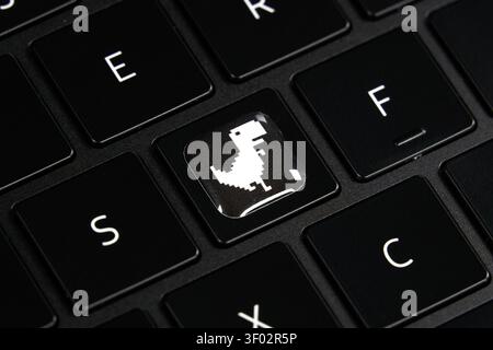 DALLAS, TX, USA - FEBRUARY 16, 2024: A black keyboard features a unique keycap replacing the usual character with an illustration of the iconic Chrome Stock Photo
