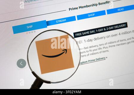 CARROLLTON, TX, USA - FEBRUARY 19, 2024: The Amazon Prime Membership Benefits page is displayed on a computer screen, with a magnifying glass Stock Photo