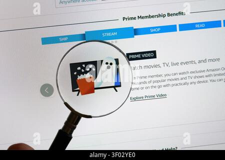 CARROLLTON, TX, USA - FEBRUARY 19, 2024: Close-up view of a computer screen showing a streaming service webpage with a magnifying glass focused on a t Stock Photo