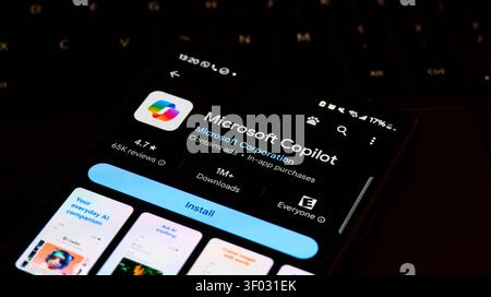 CARROLLTON, TX, USA - FEBRUARY 24, 2024: A smartphone screen shows the Microsoft Copilot app ready to install, featuring high download stats and ratin Stock Photo