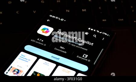 CARROLLTON, TX, USA - FEBRUARY 24, 2024: A smartphone shows the Microsoft Copilot app page on Google Play Store, highlighting its features, ratings, a Stock Photo
