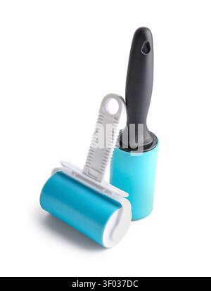 Different lint rollers on white background Stock Photo
