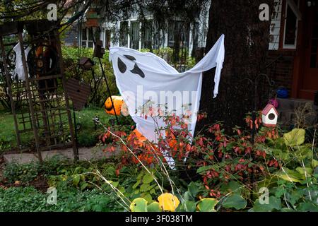 Happy-go-lucky Halloween ghost cavorting in my front yard wanting me to come out and play! I hope I did! St Paul Minnesota MN USA Stock Photo