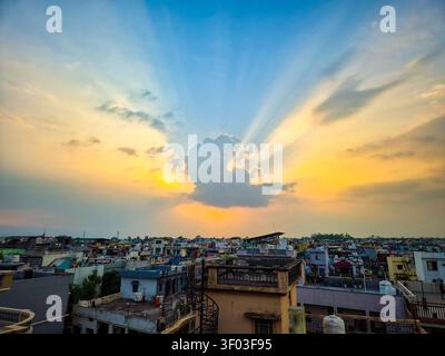 Golden Sun Rays Breaking Through Clouds Above Dehradun, Uttarakhand, India Stock Photo