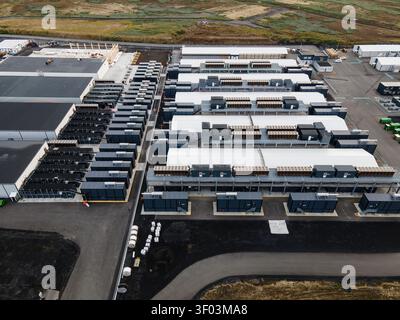 Aerial view of a large data center facility with rows of server containers and industrial infrastructure in Keflavik, Reykjanesbaer, Iceland. Stock Photo