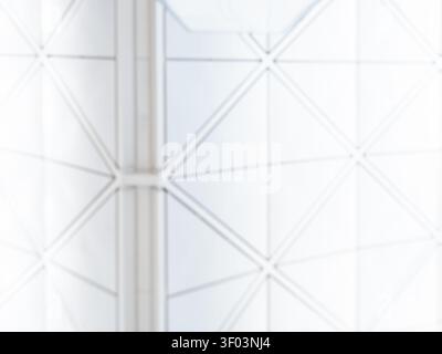 Abstract geometric architecture background featuring blurred modern building ceiling with triangular pattern, minimal corporate design, contemporary s Stock Photo