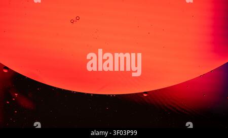 A vivid warm gradient with a sweeping orange red curve forming an abstract background, soft lighting, and smooth textures creating a dramatic, colorful mood Stock Photo