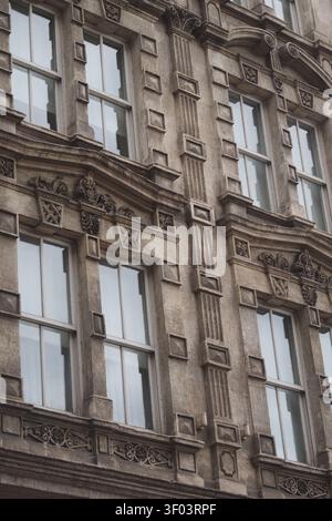 Building with detailed architecture in a city setting Stock Photo