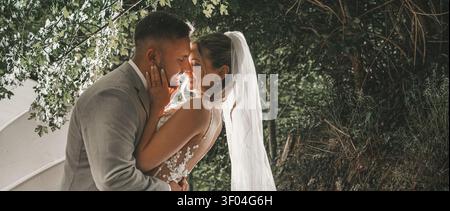happy, laughing bride and groom at the wedding. Celebrate an emotional wedding. Stock Photo