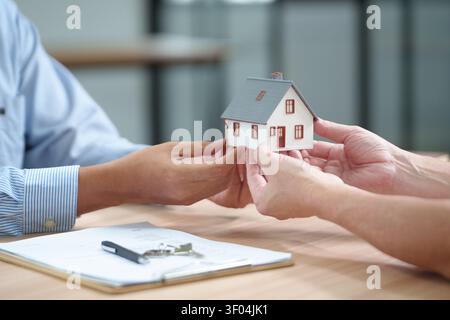 Real Estate Deal with House Model, Documents and Keys Stock Photo