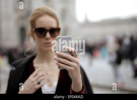 Young woman in sunglasses taking a selfie Stock Photo