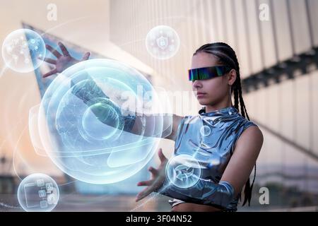 Futuristic woman interacts with a holographic user interface Stock Photo