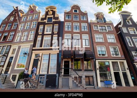 Narrow gabled houses along Amstel Street / River, Amsterdam, Holland, the Netherlands, Europe Stock Photo