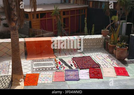 Moroccan carpet. Traditional wool carpets from a street vendor in a souk in Taghazout. Morocco handicraft. Stock Photo