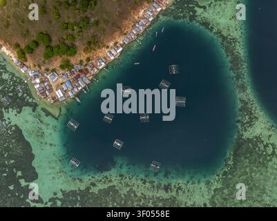 Floting Farm Aerial view of Pulau Kukusan featuring a coastal village, traditional ...