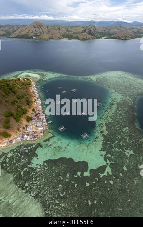 Floting Farm Aerial view of Pulau Kukusan featuring a coastal village, traditional ...