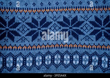 Nordic Knit Pattern Background. Texture Christmas sweater. Knitted wear Stock Photo