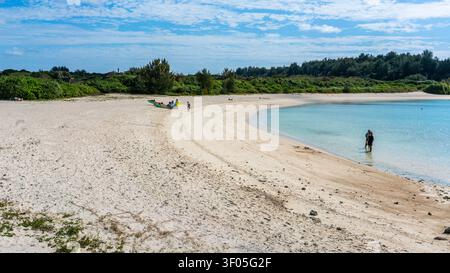 Miyakojima Japan , 18 January 2026 : View of sunset beach with people on Miyako island in winter in Miyakojima Japan Stock Photo