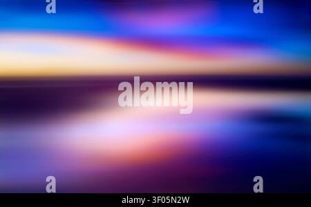 Soft focus abstract sky and sunset reflections over calm water. Stock Photo