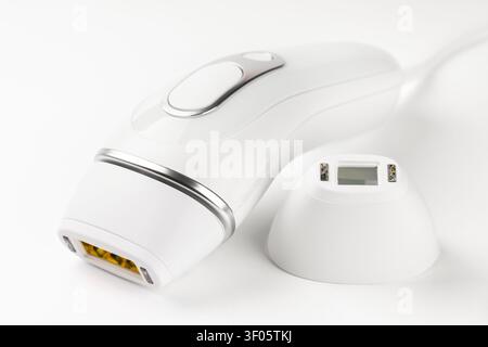 Close up of IPL photoepilator and precision attachment isolated on white background. Modern beauty device for removing unwanted hair, technology for h Stock Photo