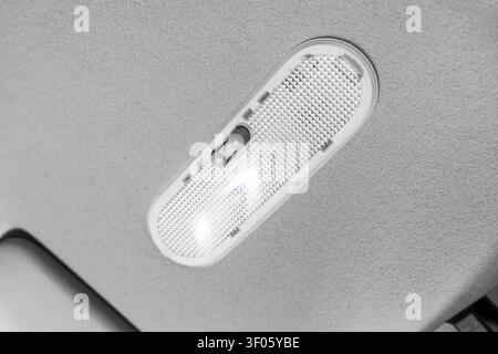 Close-up of car interior dome light switch Stock Photo