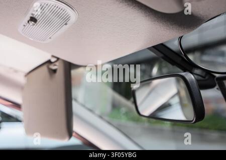 Interior view of car rearview mirror and sun visor Stock Photo