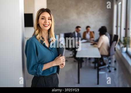 Multicultural professional businesspeople working together on research plan in boardroom. Stock Photo