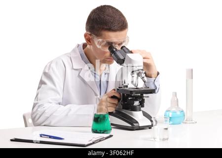 Laboratory scientist looking through microscope isolated on white background Stock Photo