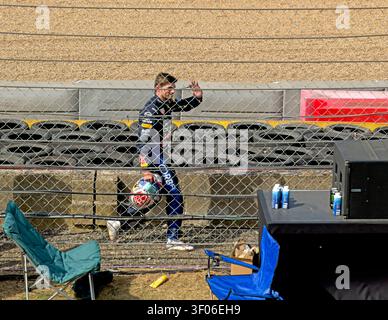 Helmet in hand, Max Verstappen waves to Landostands as he walks back past the barriers after his Red Bull crash at Stowe, Silverstone, 05 Jul 2026. Stock Photo