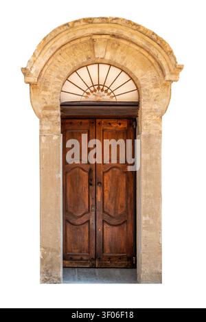 Ancient Italian double wooden door with a rustic stone archway and a decorative sunburst transom window. Elegant historic entrance of a traditional ho Stock Photo