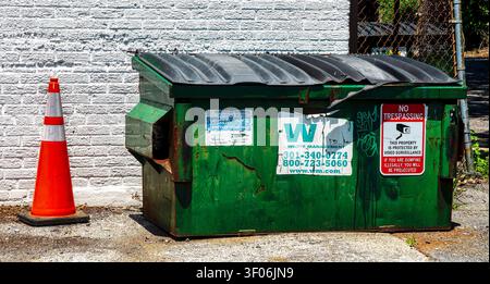A commercial dumpster by Waste management Stock Photo