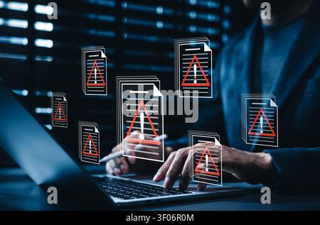 Data breach alert and corrupted file virus error system concept. Person typing on laptop computer to detect malware infection, cyber attack hazard, Stock Photo