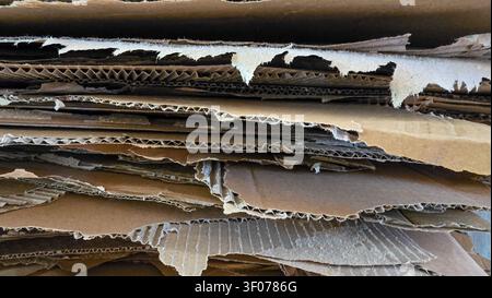 Full frame of the cardboard crates stacked background. Stacking used cardboard for recycling Stock Photo