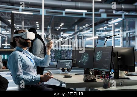 Concerned data center engineer reviews warning messages in a data center while troubleshooting errors affecting equipment performance. Stock Photo