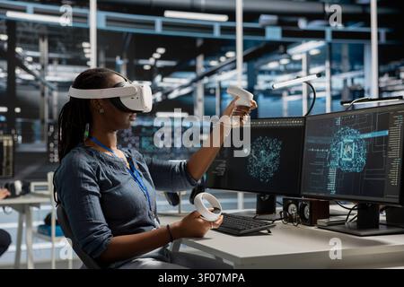 Data center programmer uses a VR headset to inspect AI neural networks and server systems in a high-tech facility. Stock Photo