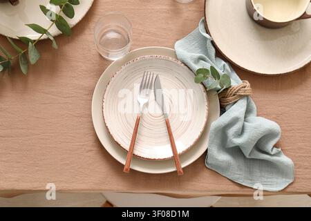Rustic table setting with plates and cutlery Stock Photo