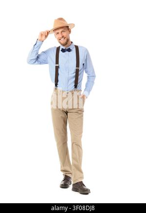 Smiling man in vintage style outfit tipping hat Stock Photo