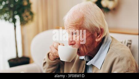 Coffee, drinking and senior man in home for morning beverage, comfort or retirement. Elderly, male person or pensioner thinking with cup or mug of Stock Photo