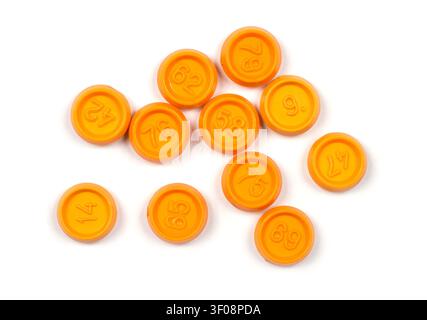 Lotto chips with different numbers on a white background. Orange plastic chips with numbers. Stock Photo
