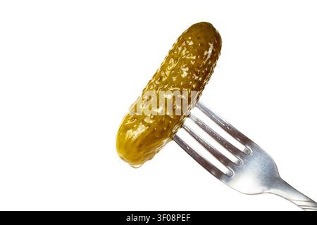 Pickled cucumber on a fork. Pickled cucumber on a white background. Stock Photo