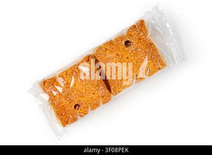 Cookies in plastic packaging on a white background. Two sweet cookies on a white background. Stock Photo