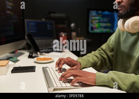Midsection of Man Coding at Desk for Software Development Project Stock Photo