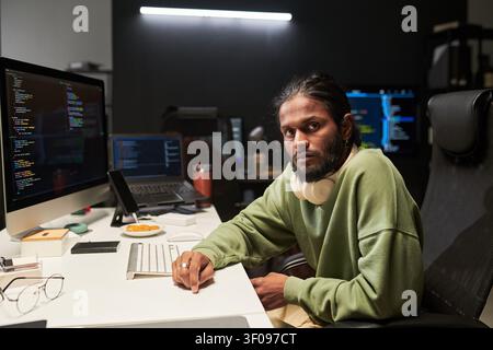 Portrait of Man Coding at Desk in Software Development Stock Photo