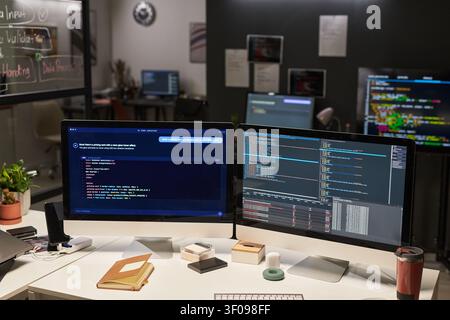 Developer Workstation Displaying AI Coding Workflow in Office Stock Photo