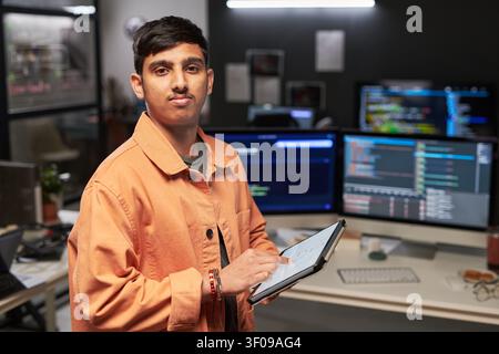 Portrait of Web Engineer Using Tablet in Software Development Stock Photo